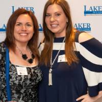 2 women take picture at photo station